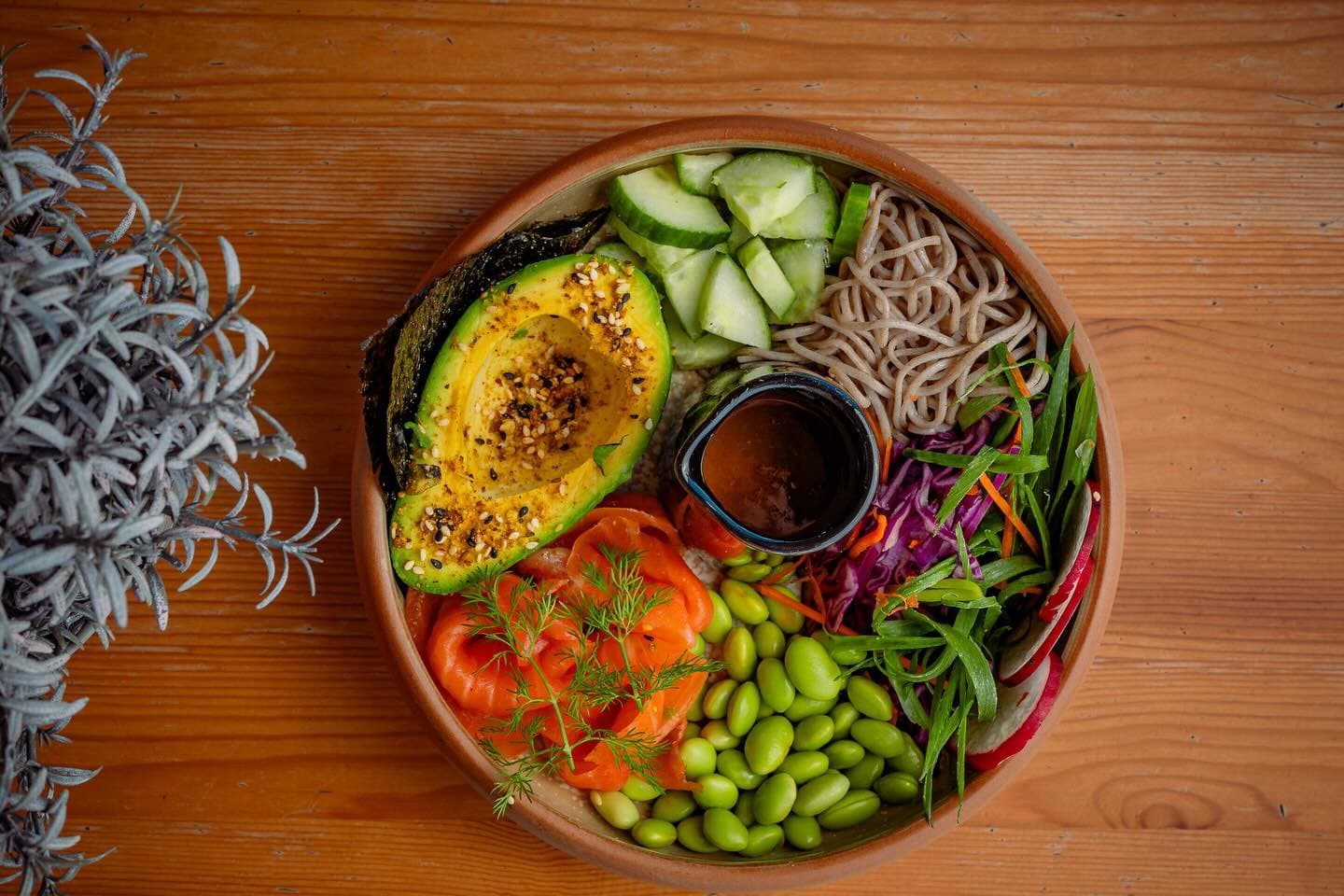 Jumbo poke bowl with smoked salmon, avocado, soba noodles and vegetables