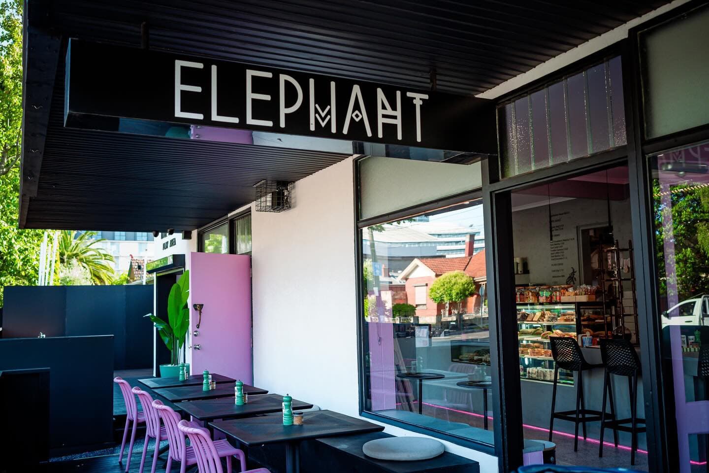 The Elephant Café terrace in Moonee Ponds, with pink chairs and our signature elephant door