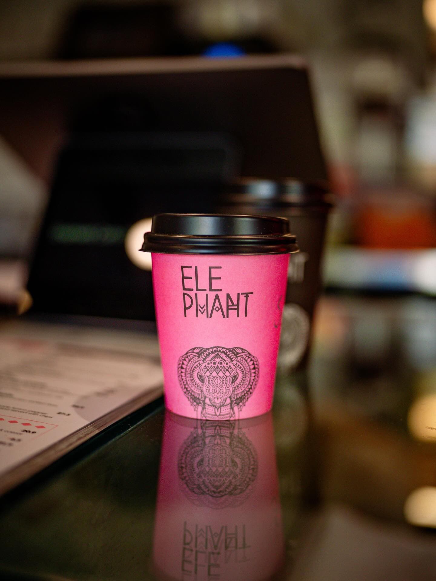 An Elephant Café coffee in our signature pink cup